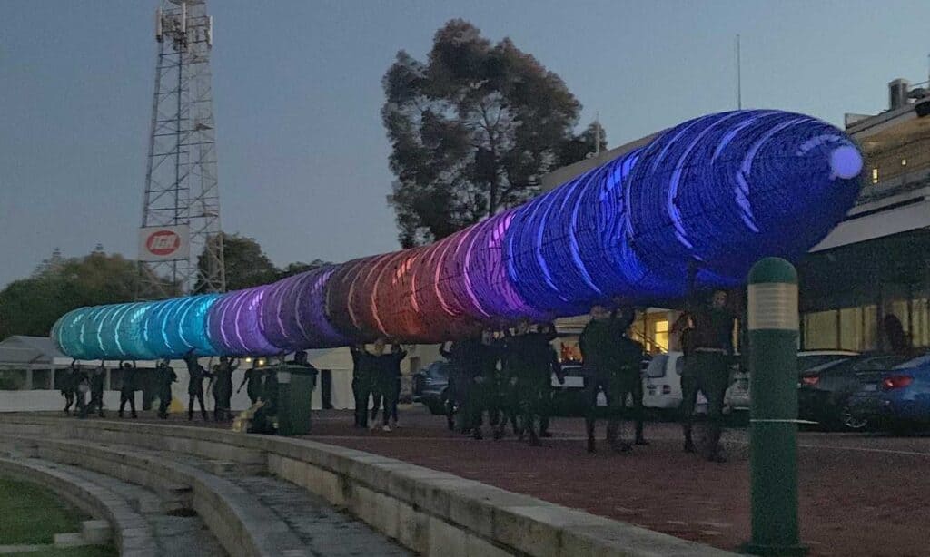 The 36 meter illuminated structure was transported manually by dozens of volunteers for the eight day festival