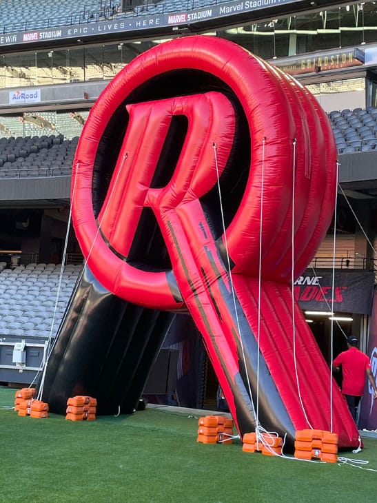 A seven-meter-high inflatable "R" shaped entry arch was selected as the final design using PMS-matched colours for cohesion with their brand and design elements pulled from their logo.