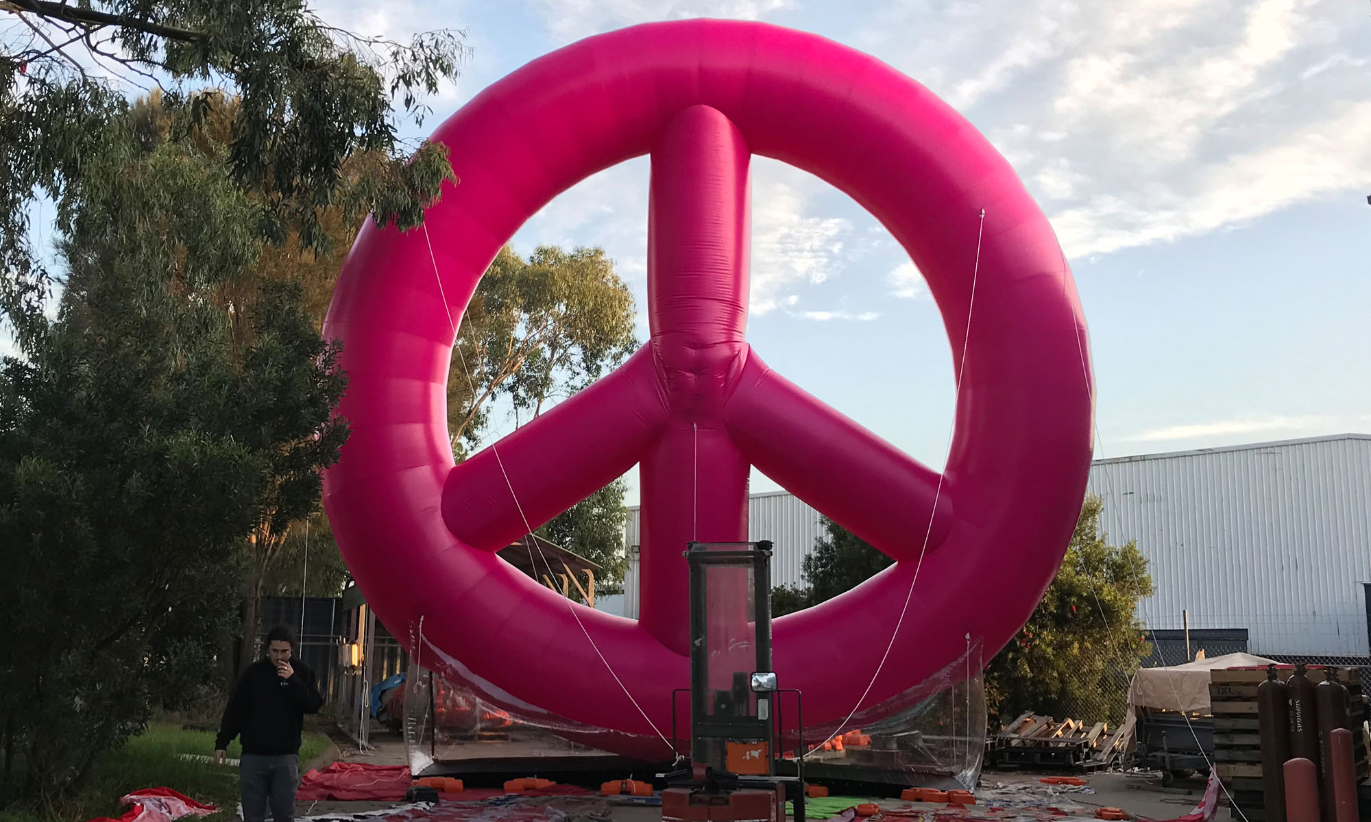 We created the peace symbol with a heavier-duty PVC material in highly vibrant pink.