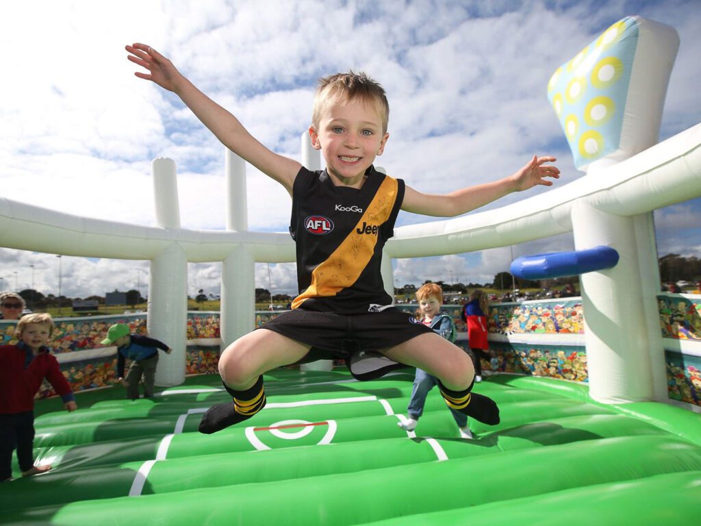 AFL jumping castles are a popular addition for sponsors for pre-game sponsorship opportunities - They are an excellent solution for fan engagement for younger AFL fans.