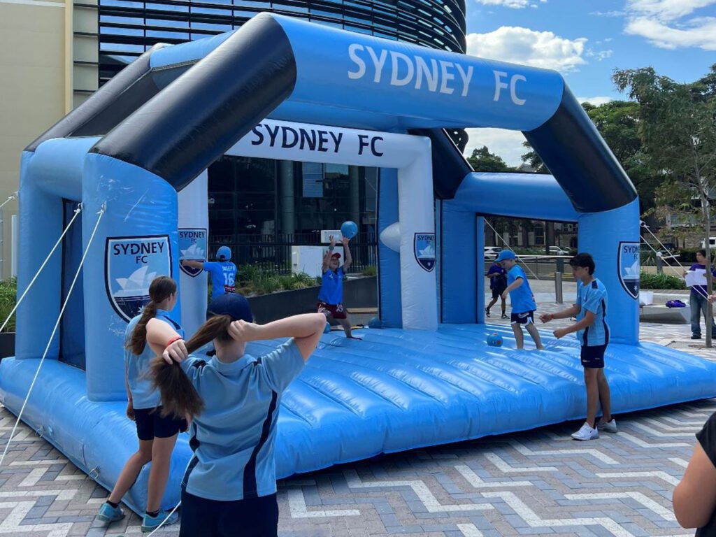 Inflatable soccer goal with deck