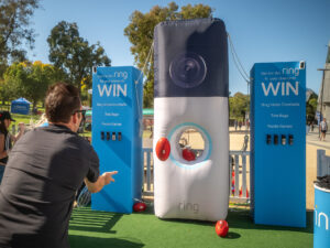 Custom inflatable Ring doorbell with central target hole for football passing game featuring high-definition printing and integrated ballast system